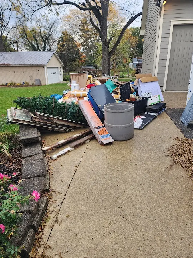 Dumpster being loaded with debris for Residential Dumpster Rental in Swartz